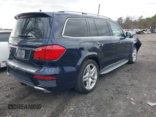 2014 Mercedes-Benz GL-Class GL 550 with VIN 4JGDF7DE2EA313661, listed as a IAAI auction lot 41214931 with 102,469 mi miles. Bid and sale history available at carsss.com. Image 4.