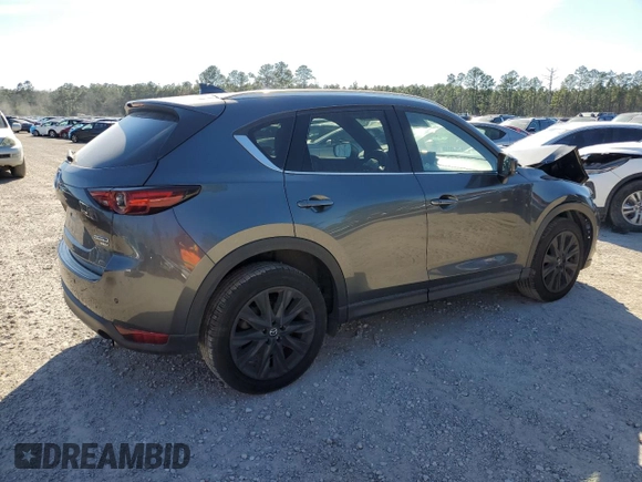 2021 Mazda CX-5 Signature with VIN JM3KFBEY2M0437304, listed as a Copart auction lot 88841415 with 57,100 mi miles and Salvage Title. Bid and sale history available at carsss.com. Image 3.