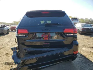 2018 Jeep Grand Cherokee Altitude with VIN 1C4RJFAGXJC296051, listed as a Copart auction lot 53450135 with 65,838 mi miles and Salvage title. Bid and sale history available at DreamBid. Image 6.