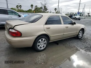 2001 Mazda 626 LX with VIN 1YVGF22CX15238033, listed as a Copart auction lot 47245985 with 91,735 mi miles and Salvage Title. Bid and sale history available at carsss.com. Image 3.