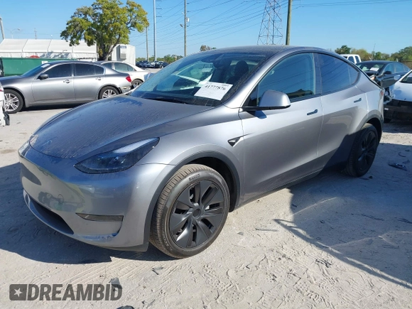 2025 Tesla Model Y Long Range with VIN 7SAYGDED7SA376233, listed as a IAAI auction lot 41777876 with 70 mi miles and . Bid and sale history available at DreamBid. Image 21.