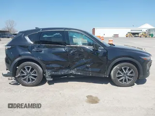 2018 Mazda CX-5 Grand Touring with VIN JM3KFADM8J0330035, listed as a IAAI auction lot 41878680 with 62,632 mi miles. Bid and sale history available at carsss.com. Image 14.