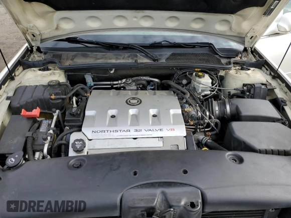 2003 Cadillac DeVille DTS z VIN 1G6KF57993U201484, wystawiony jako Copart lot #43742375 z przebiegiem 53 478 mil mil oraz Szkody całkowita. Historia ofert i sprzedaży dostępna na DreamBid. Obrazek 13.