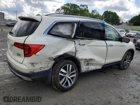 2017 Honda Pilot Touring with VIN 5FNYF6H91HB092062, listed as a Copart auction lot 52761765 with 141,750 mi miles and Salvage Title. Bid and sale history available at DreamBid. Image 3.