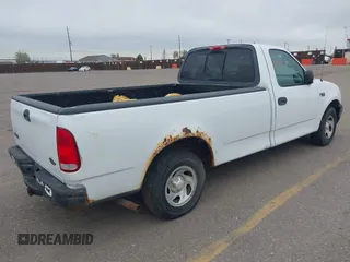 2003 Ford F-150 XL with VIN 1FTRF17273NA15637, listed as a IAAI auction lot 41952924 with 215,704 mi miles and . Bid and sale history available at DreamBid. Image 4.