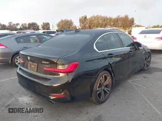 2021 BMW 3 Series 330i with VIN 3MW5R1J02M8B95303, listed as a IAAI auction lot 42184843 with 55,928 mi miles and . Bid and sale history available at carsss.com. Image 4.