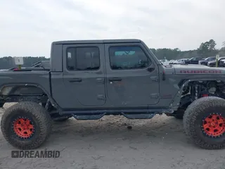 2021 Jeep Gladiator Rubicon with VIN 1C6JJTBG7ML554354, listed as a IAAI auction lot 41796943 with 61,513 mi miles and . Bid and sale history available at DreamBid. Image 14.