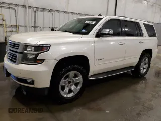 2015 Chevrolet Tahoe LTZ z VIN 1GNSCCKC5FR112071, wystawiony jako Copart lot #60681815 z przebiegiem 211 853 mil mil oraz Czysty tytuł • Clean title. Historia ofert i sprzedaży dostępna na DreamBid. Obrazek 1.
