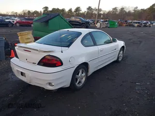 1999 Pontiac Grand Am GT with VIN 1G2NW12E3XM830305, listed as a IAAI auction lot 41797278 with 87,537 mi miles. Bid and sale history available at carsss.com. Image 4.