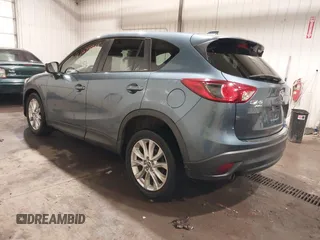 2015 Mazda CX-5 Grand Touring with VIN JM3KE4DY7F0504398, listed as a IAAI auction lot 41698365 with 122,121 mi miles. Bid and sale history available at carsss.com. Image 3.