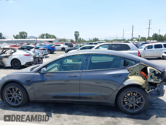 2023 Tesla Model 3 with VIN 5YJ3E1EA4PF400306, listed as a IAAI auction lot 42398603 with 18,551 mi miles and . Bid and sale history available at DreamBid. Image 15.