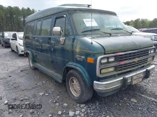1995 Chevrolet Chevy Van z VIN 1GBEG25K0SF243254, wystawiony jako IAAI lot #41915622 z przebiegiem 74 262 mil mil oraz . Historia ofert i sprzedaży dostępna na DreamBid. Obrazek 1.