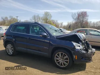 2011 Volkswagen Tiguan SE with VIN WVGBV7AX1BW563598, listed as a Copart auction lot 54215895 with 109,373 mi miles and Salvage Title. Bid and sale history available at DreamBid. Image 4.