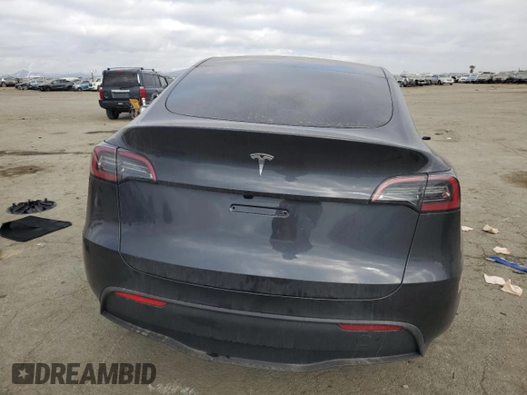 2025 Tesla Model Y Long Range with VIN 7SAYGDED6SF227475, listed as a Copart auction lot 42634345 with 3,493 mi miles and Salvage Title. Bid and sale history available at DreamBid. Image 6.