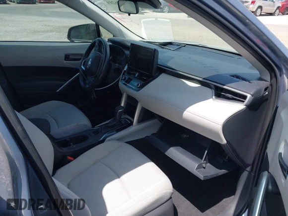 2023 Toyota Corolla Cross LE with VIN 7MUCAAAGXPV045651, listed as a IAAI auction lot 42006289 with 23,282 mi miles and . Bid and sale history available at DreamBid. Image 5.