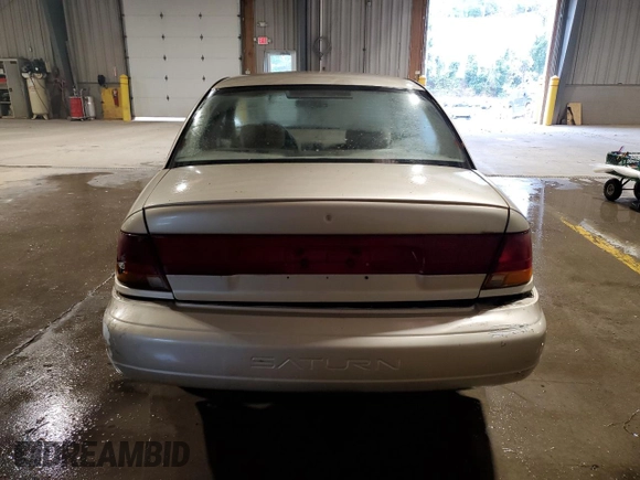 1996 Saturn SL z VIN 1G8ZK5274TZ233706, wystawiony jako Copart lot #54247795 z przebiegiem 62 941 mil mil oraz Czysty tytuł • Clean title. Historia ofert i sprzedaży dostępna na DreamBid. Obrazek 6.