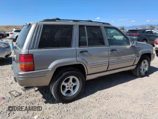 1998 Jeep Grand Cherokee Limited z VIN 1J4GZ88Z8WC306919, wystawiony jako Copart lot #61505725 z przebiegiem 195 329 mil mil oraz Czysty tytuł • Clean title. Historia ofert i sprzedaży dostępna na DreamBid. Obrazek 3.