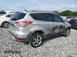 2015 Ford Escape Titanium z VIN 1FMCU0J97FUA14845, wystawiony jako Copart lot #58911445 z przebiegiem 110 437 mil mil oraz Szkoda całkowita • Salvage title. Historia ofert i sprzedaży dostępna na DreamBid. Obrazek 3.