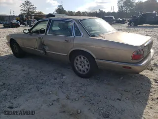 1998 Jaguar XJ with VIN SAJHX1242WC845736, listed as a Copart auction lot 82006044 with 188,785 mi miles and Salvage Title. Bid and sale history available at carsss.com. Image 2.