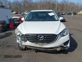 2016 Mazda CX-5 Grand Touring with VIN JM3KE4DYXG0836692, listed as a IAAI auction lot 41812584 with 119,302 mi miles. Bid and sale history available at carsss.com. Image 12.