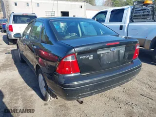 2007 Ford Focus S with VIN 1FAHP34N07W166828, listed as a IAAI auction lot 41992308 with 143,169 mi miles. Bid and sale history available at carsss.com. Image 3.