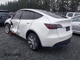2022 Tesla Model Y Long Range z VIN 7SAYGDEE6NF451259, wystawiony jako IAAI lot #41200775 z przebiegiem 59 683 mil mil oraz . Historia ofert i sprzedaży dostępna na DreamBid. Obrazek 3.