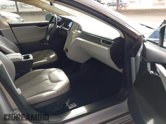 2014 Tesla Model S 60 with VIN 5YJSA1H17EFP35351, listed as a IAAI auction lot 41558434 with 151,002 mi miles and . Bid and sale history available at DreamBid. Image 5.
