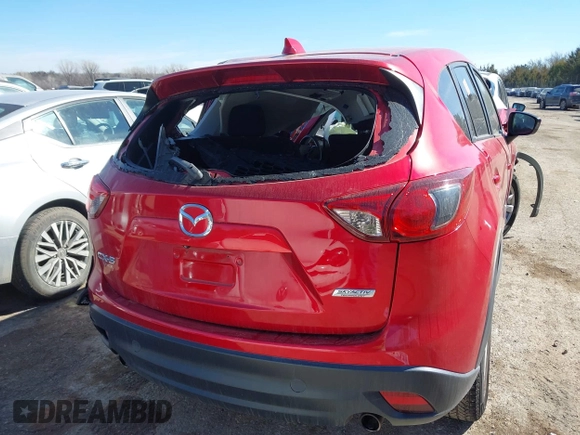 2014 Mazda CX-5 Touring z VIN JM3KE2CY2E0364488, wystawiony jako IAAI lot #41635188 z przebiegiem 127 688 mil mil oraz . Historia ofert i sprzedaży dostępna na DreamBid. Obrazek 16.