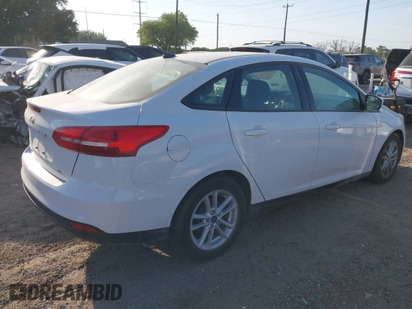2018 Ford Focus SE z VIN 1FADP3F23JL328462, wystawiony jako IAAI lot #42068209 z przebiegiem 63 194 mil mil oraz . Historia ofert i sprzedaży dostępna na DreamBid. Obrazek 4.