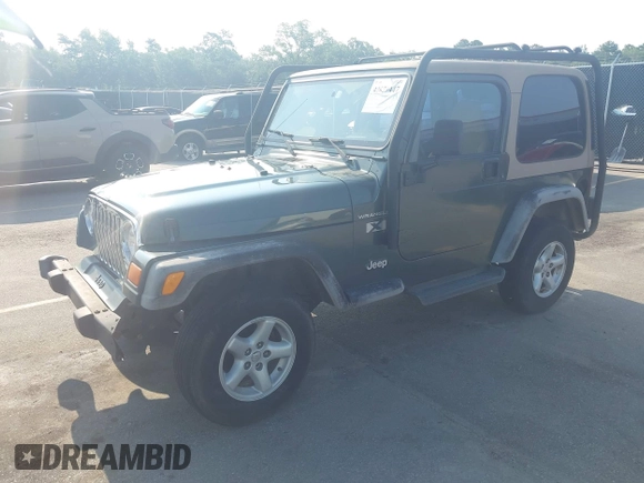 2002 Jeep Wrangler X with VIN 1J4FA39S72P733034, listed as a IAAI auction lot 42659447 with 200,786 mi miles and . Bid and sale history available at DreamBid. Image 17.