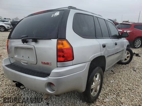 2009 GMC Envoy SLE with VIN 1GKDS33S492129469, listed as a Copart auction lot 83232024 with 131,735 mi miles and Salvage Title. Bid and sale history available at carsss.com. Image 3.