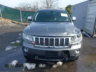 2013 Jeep Grand Cherokee Overland with VIN 1C4RJFCG8DC581719, listed as a IAAI auction lot 41566666 with 152,332 mi miles. Bid and sale history available at carsss.com. Image 6.