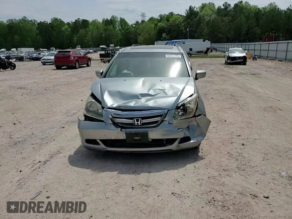 2007 Honda Odyssey EX-L with VIN 5FNRL38657B059033, listed as a Copart auction lot 54005495 with 212,674 mi miles and Salvage Title. Bid and sale history available at DreamBid. Image 14.