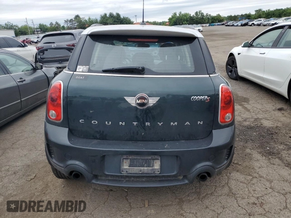 2014 MINI Countryman S with VIN WMWZC5C58EWP39797, listed as a Copart auction lot 62193515 with 84,989 mi miles and Salvage title. Bid and sale history available at DreamBid. Image 6.