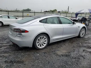 2017 Tesla Model S 100D with VIN 5YJSA1E20HF190126, listed as a Copart auction lot 60087655 with 42,025 mi miles and Salvage title. Bid and sale history available at DreamBid. Image 3.