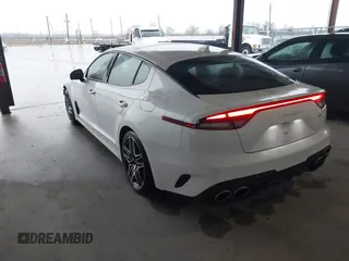 2023 Kia Stinger GT2 with VIN KNAE55LCXP6135128, listed as a IAAI auction lot 41281782 with 6,272 mi miles. Bid and sale history available at carsss.com. Image 3.