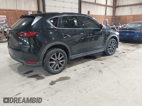 2017 Mazda CX-5 Grand Touring with VIN JM3KFBDL6H0143013, listed as a IAAI auction lot 41912979 with 122,890 mi miles. Bid and sale history available at carsss.com. Image 4.