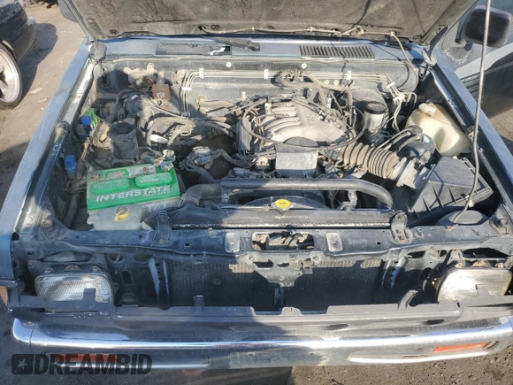 1993 Nissan Frontier SE z VIN 1N6HD16Y9PC398809, wystawiony jako Copart lot #70628754 z przebiegiem 224 511 mil mil oraz Szkoda całkowita • Salvage title. Historia ofert i sprzedaży dostępna na DreamBid. Obrazek 11.