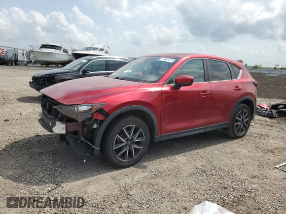 2018 Mazda CX-5 Touring with VIN JM3KFACM8J1469772, listed as a Copart auction lot 54863415 with 97,592 mi miles and Salvage Title. Bid and sale history available at carsss.com. Image 1.