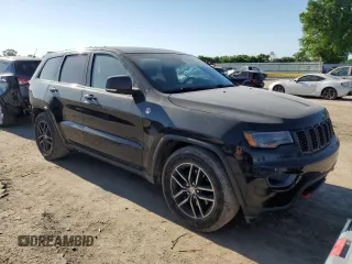 2017 Jeep Grand Cherokee Trailhawk with VIN 1C4RJFLG3HC881805, listed as a Copart auction lot 56471445 with 122,843 mi miles and Salvage title. Bid and sale history available at DreamBid. Image 4.