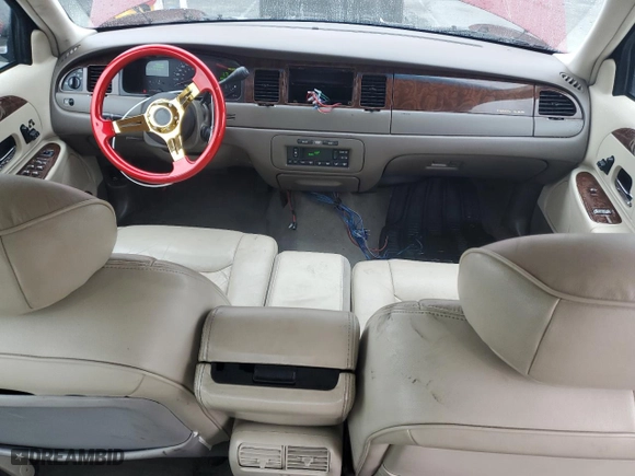 1999 Lincoln Town Car Signature with VIN 1LNHM82W7XY612906, listed as a Copart auction lot 50777435 with 110,414 mi miles and Salvage Title. Bid and sale history available at carsss.com. Image 8.