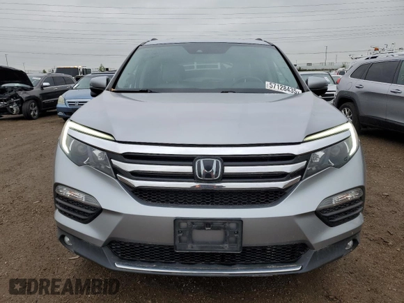 2018 Honda Pilot Touring z VIN 5FNYF6H94JB039992, wystawiony jako Copart lot #57128435 z przebiegiem 85 578 mil mil oraz Szkoda całkowita • Salvage title. Historia ofert i sprzedaży dostępna na DreamBid. Obrazek 5.