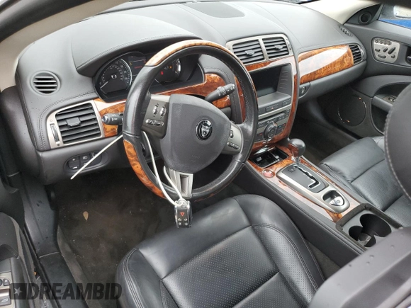 2007 Jaguar XK with VIN SAJWA43B475B12815, listed as a Copart auction lot 75012064 with 55,917 mi miles and Salvage Title. Bid and sale history available at carsss.com. Image 8.