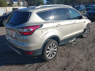 2017 Ford Escape Titanium with VIN 1FMCU0JD2HUD92675, listed as a IAAI auction lot 41834723 with 113,503 mi miles. Bid and sale history available at carsss.com. Image 4.