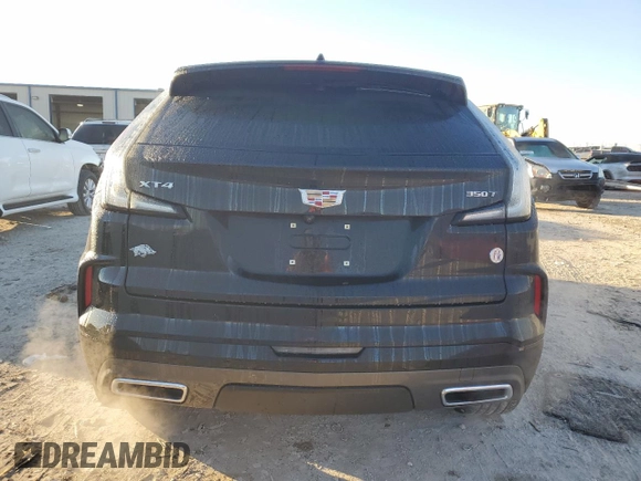 2024 Cadillac XT4 FWD Sport with VIN 1GYFZER47RF101186, listed as a Copart auction lot 79128454 with 10,499 mi miles and Salvage title. Bid and sale history available at DreamBid. Image 6.