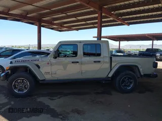 2022 Jeep Gladiator Rubicon with VIN 1C6JJTBG2NL164117, listed as a IAAI auction lot 42450350 with 22,326 mi miles and . Bid and sale history available at DreamBid. Image 14.