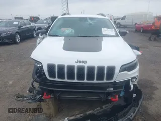 2021 Jeep Cherokee Trailhawk with VIN 1C4PJMBX4MD239112, listed as a IAAI auction lot 42271040 with 62,917 mi miles and . Bid and sale history available at DreamBid. Image 13.