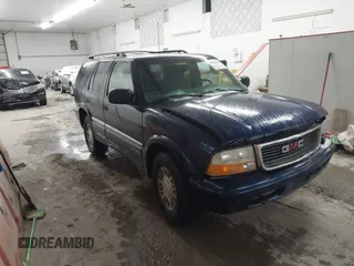 1999 GMC Jimmy SLE with VIN 1GKDT13W8X2534672, listed as a IAAI auction lot 41562434 with 240,145 mi miles. Bid and sale history available at carsss.com. Image 1.