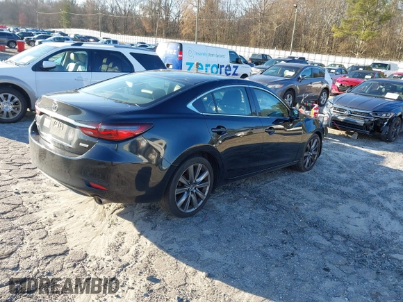 2018 Mazda Mazda6 Touring with VIN JM1GL1VM4J1307304, listed as a IAAI auction lot 41556563 with 173,739 mi miles. Bid and sale history available at carsss.com. Image 4.