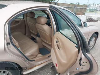 1996 Mercury Sable LS z VIN 1MELM53S1TG638988, wystawiony jako IAAI lot #42523616 z przebiegiem 87 087 mil mil oraz . Historia ofert i sprzedaży dostępna na DreamBid. Obrazek 8.